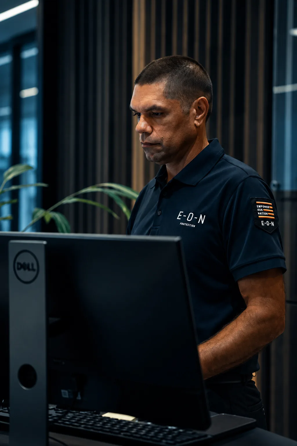 EON Protection officer at a workstation in the operations office